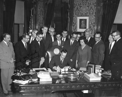Governor Dan Evans signing the redistricting bill